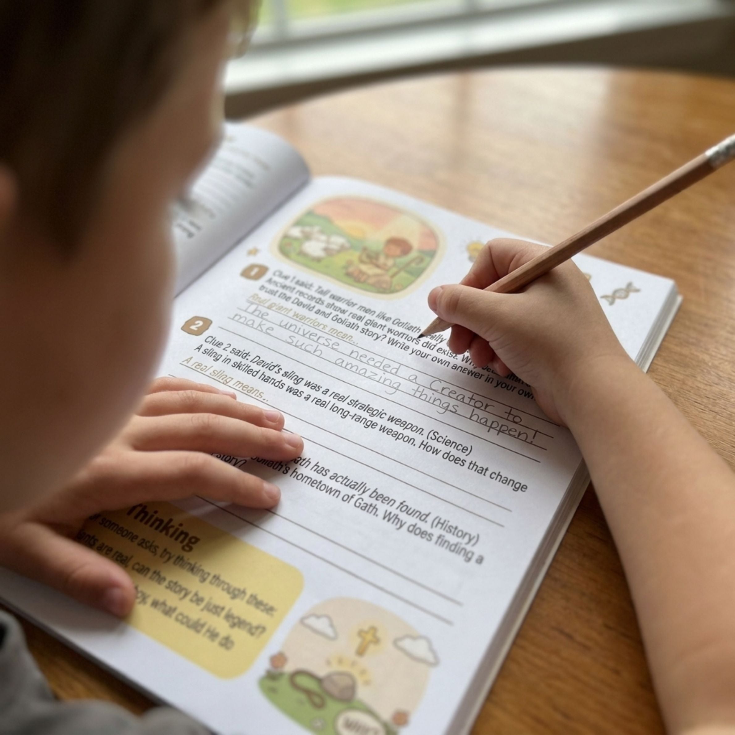 A child writing their own answer on the practice page